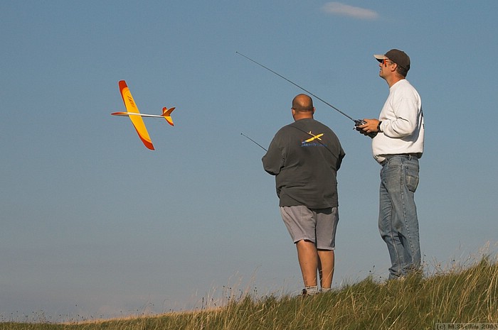 Andy (left) low passing his Mach One during sport flying. Model sports wingerons for super fast rolls.