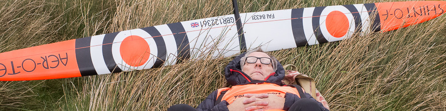Les Wood resting in the grass with his Shinto