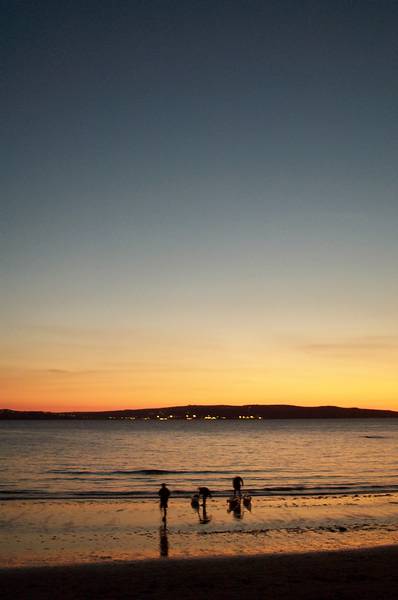 Canoists at sunset, Dinas head.