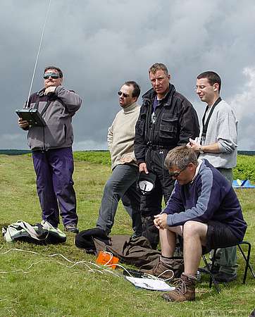 Chatting and waiting for some wind, and the rain to pass.