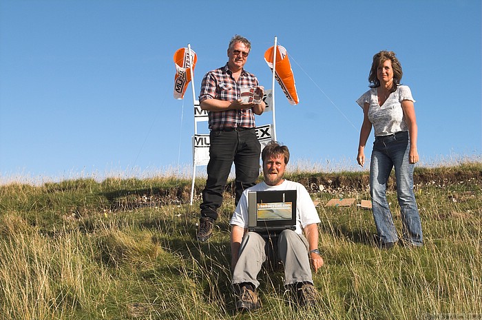 John Bennett (left) with third place trophy, with Simon Hall on the computer and Lynda at right.