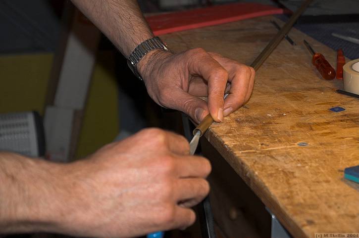 Sharpening a tube to use for cutting lightening holes.
