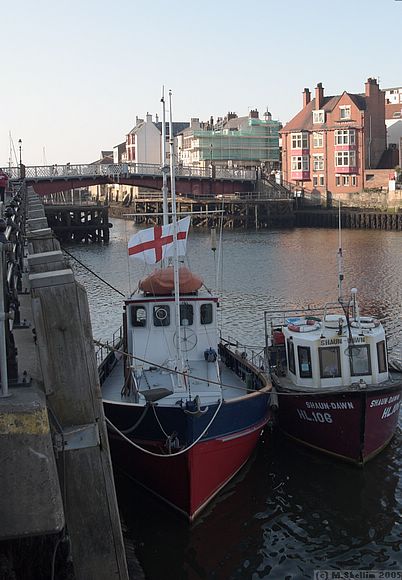 View looking out from the harbour towards the sea.