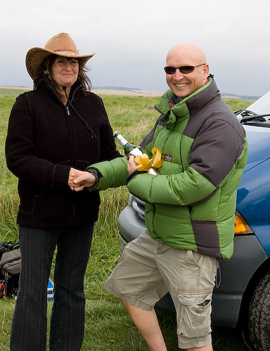 Kevin accepts the winner's trophy from Lynda Blythe