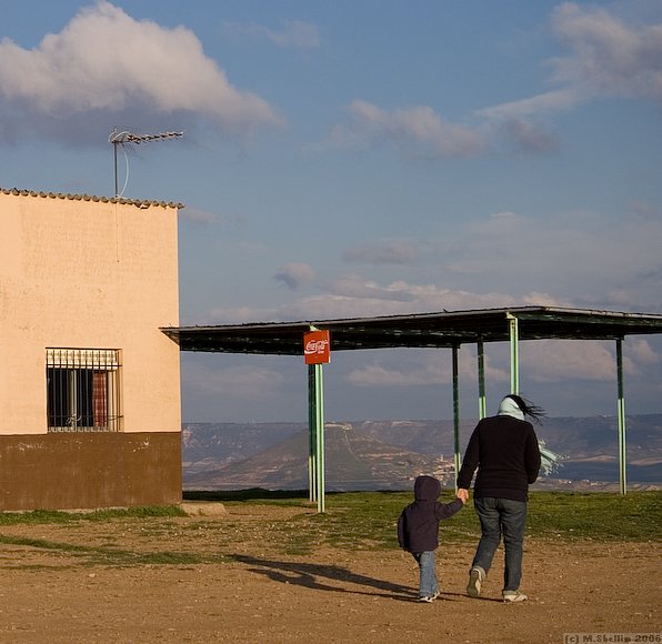 Cafe and windswept visitors