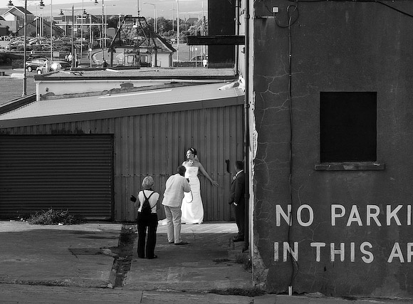 Happy bride, but what a curious backdrop