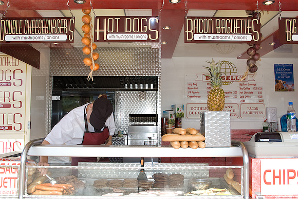 Shy chef at one of the many hamburger stalls