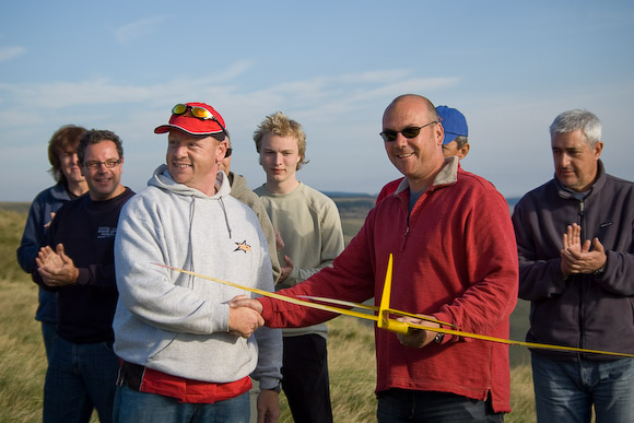 Julian Perrot has reason to look pleased, as he accepts his Air One Mini from sponsor Ian Mason.