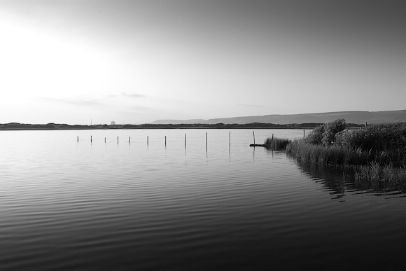 The pool at Kenfig. Just visible on the horizon are the steel works at Port Talbot.