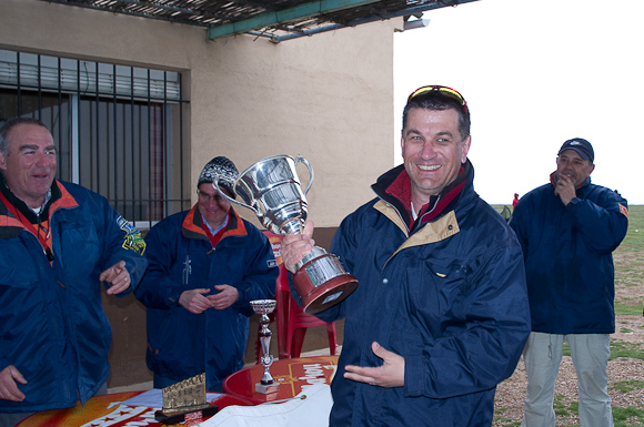 Pierre accepts winners trophy