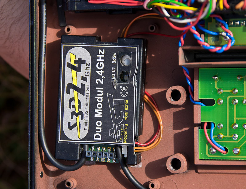 ACT dual 2.4 GHz transmitter module installed in a free area to the left of the battery bay (battery removed). Note two RF feeds exiting from the bottom. Easy access to 3030 internals make it a good candidate for conversion.