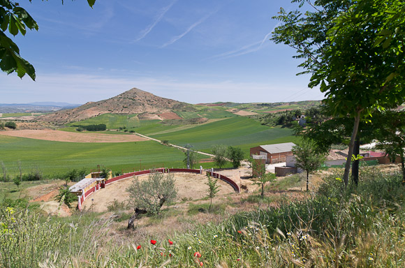 At the bottom of La Muela, looking out towards el Colmillo. Bullring in the foreground belongs to the village.